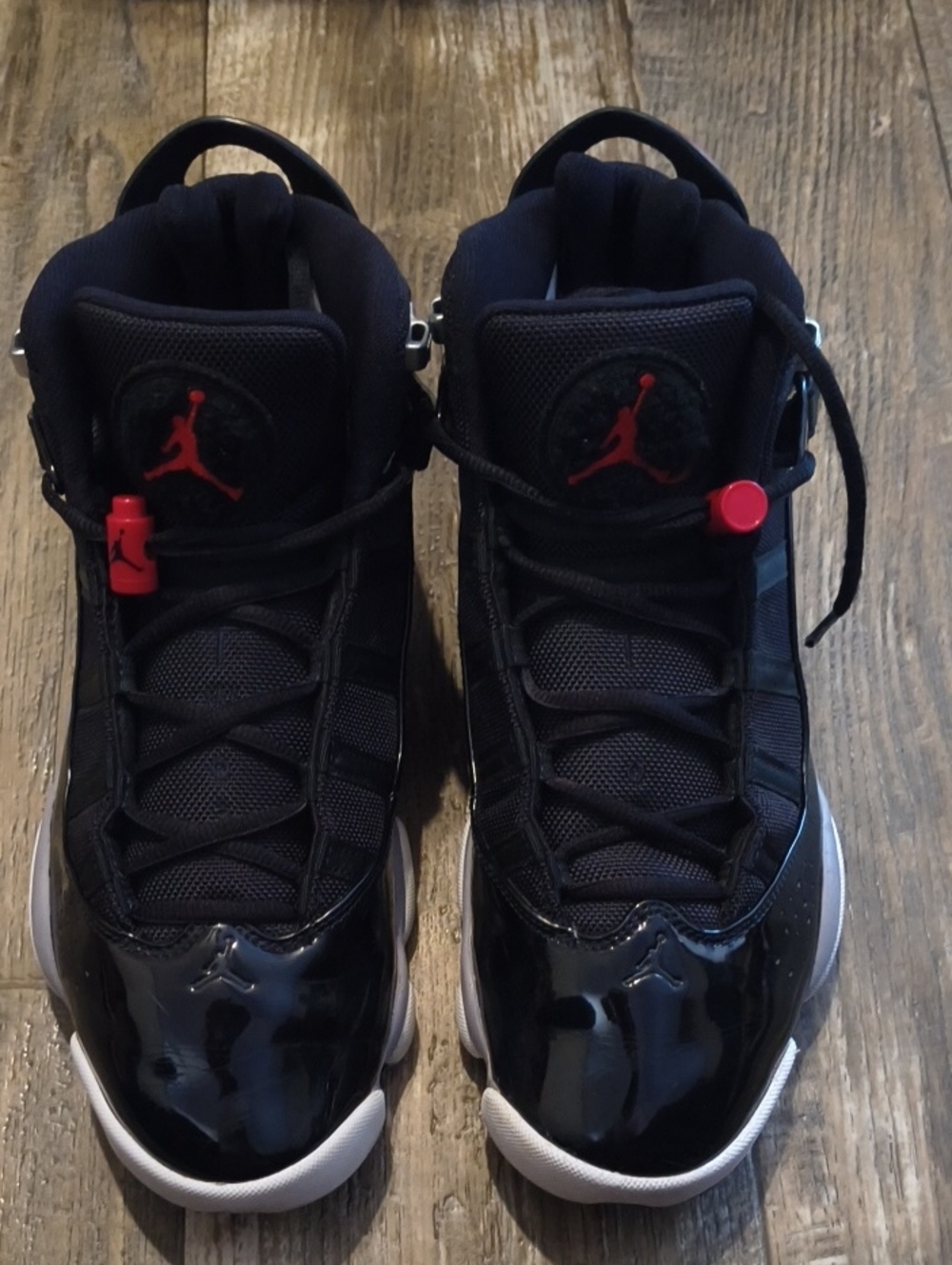 Jordan Men’s High-Top Sneakers in Black with Red Accents